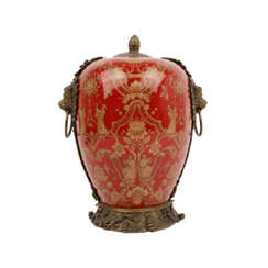 Lidded vessel with Asian decoration.