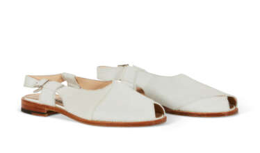 A PAIR OF WHITE PONY HAIR SANDALS