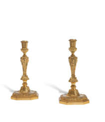 A PAIR OF LOUIS XVI STYLE ORMOLU-MOUNTED CANDLESTICKS