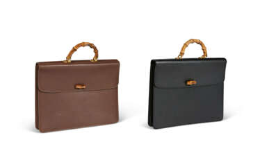A PAIR OF BLACK & BROWN LEATHER BAMBOO TOP HANDLE BRIEFCASES WITH GOLD HARDWARE