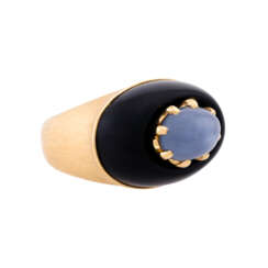 Ring with oval star sapphire embedded in onyx,