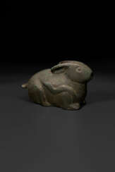 A RARE BRONZE TWO-PART RABBIT-FORM CONTAINER
