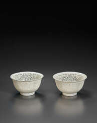 A RARE PAIR OF RETICULATED WHITE BOWLS