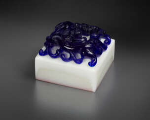 A BLUE AND WHITE GLASS &#39;CHILONG&#39; SEAL