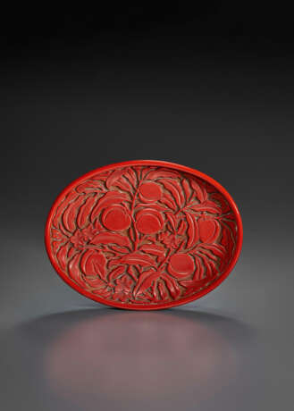 A RARE CARVED RED LACQUER OVAL `PEACH` DISH - photo 1