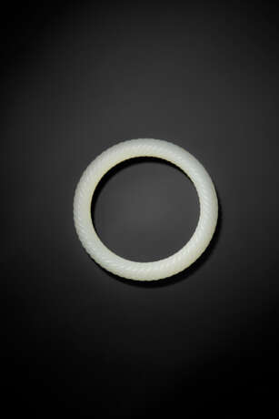 A WHITE JADE `ROPE-TWIST` BANGLE - photo 2