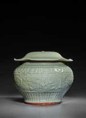 A LARGE MOLDED LONGQUAN CELADON &#39;LOTUS&#39; JAR AND COVER