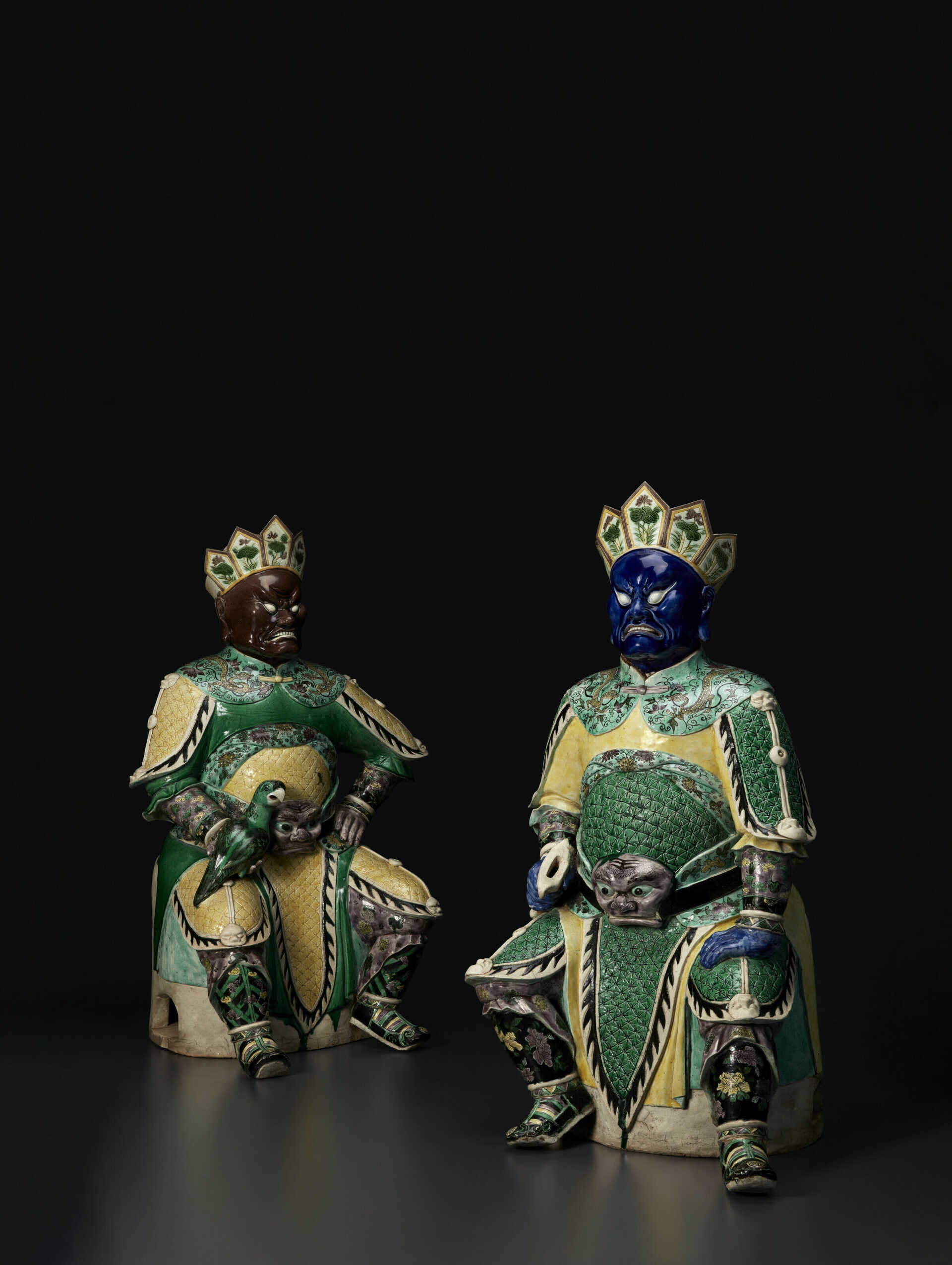 A RARE PAIR OF LARGE FAMILLE VERTE BISCUIT GUARDIAN FIGURES