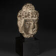 A SMALL STONE HEAD OF BUDDHA - Auction prices