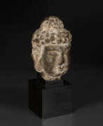 Southern and Northern dynasties. A SMALL STONE HEAD OF BUDDHA