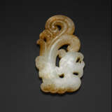 A WHITE AND BEIGE JADE ARCHAISTIC `DRAGON` CARVING - photo 1
