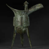 A BRONZE RITUAL TRIPOD WINE VESSEL, JUE - photo 3