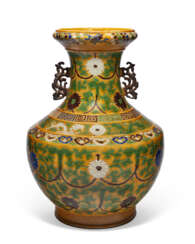 A LARGE BLUE, GREEN, AUBERGINE AND WHITE-DECORATED YELLOW-GROUND &#39;LOTUS&#39; HU-FORM VASE