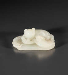 A WHITE JADE &#39;CATS AND FAN&#39; CARVING