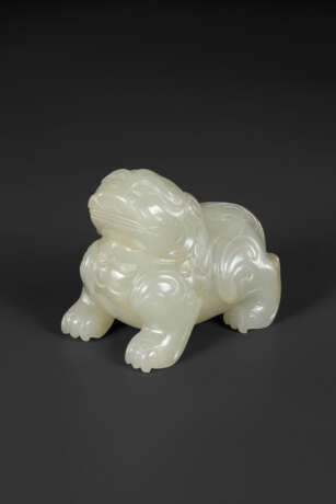 A SMALL PALE GREYISH-WHITE JADE FIGURE OF A MYTHICAL BEAST - фото 1