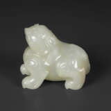 A SMALL PALE GREYISH-WHITE JADE FIGURE OF A MYTHICAL BEAST - photo 2