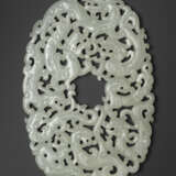 A FINELY CARVED WHITE JADE `NINE DRAGON` OVAL PLAQUE - фото 1