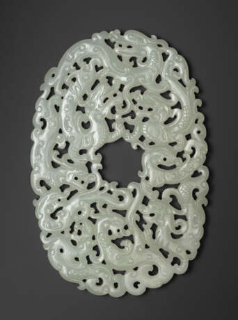 A FINELY CARVED WHITE JADE `NINE DRAGON` OVAL PLAQUE - photo 1