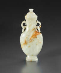 A CARVED MUGHAL-STYLE GREENISH-WHITE JADE VASE AND COVER