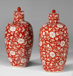 A RARE PAIR OF CORAL-RED-DECORATED VASES AND COVERS