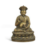 A RARE COPPER AND SILVER-INLAID BRONZE FIGURE OF NGAWANG DRAKPA (1520-1580) - photo 1