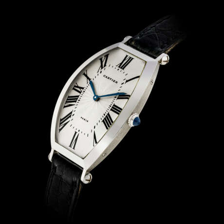 CARTIER, PLATINUM TONNEAU-SHAPED WRISTWATCH - photo 1