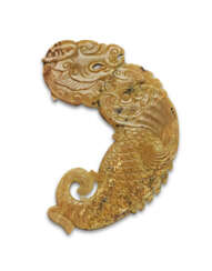 A CARAMEL-TAUPE JADE ARCHAISTIC FLATTENED DRAGON-FISH PLAQUE