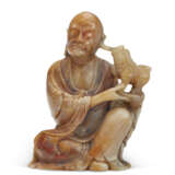A SMALL SOAPSTONE FIGURE OF A SEATED LUOHAN - photo 1