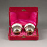 A PAIR OF PORCELAIN CUPS WITH SILVER FOOT WITHIN CASE Ru - photo 1