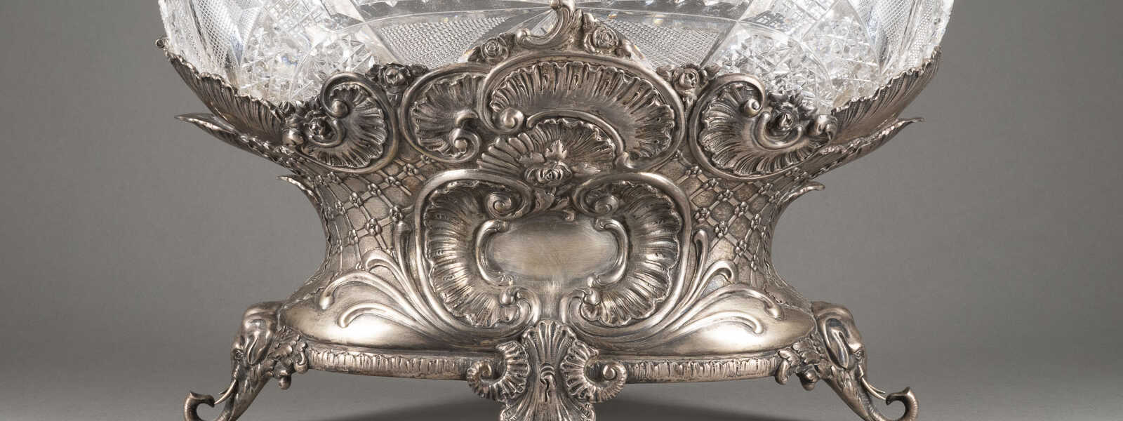 A LARGE SILVER-MOUNTED CUT GLASS CENTERPIECE ON ELEPHANT