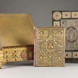 A BOOK OF GOSPELS ON A STAND AND A COVER OF A BOOK OF GO - photo 2
