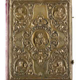 A BOOK OF GOSPELS ON A STAND AND A COVER OF A BOOK OF GO - photo 4
