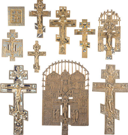 A COLLECTION OF NINE CRUCIFIXES AND A BRASS ICON SHOWING - photo 1