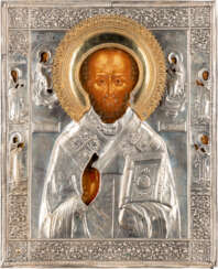 A LARGE ICON SHOWING ST. NICHOLAS OF MYRA WITH A SILVER OKL