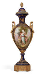A MONUMENTAL ORMOLU-MOUNTED SEVRES STYLE PORCELAIN COBALT-BLUE GROUND VASE AND COVER
