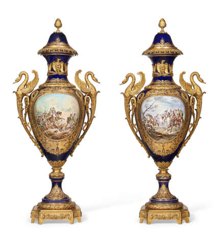 A PAIR OF VERY LARGE ORMOLU-MOUNTED SEVRES STYLE PORCELAIN COBALT-BLUE GROUND VASES AND COVERS - фото 1