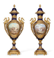 A PAIR OF VERY LARGE ORMOLU-MOUNTED SEVRES STYLE PORCELAIN COBALT-BLUE GROUND VASES AND COVERS