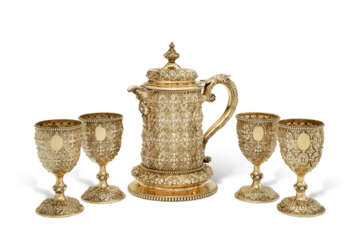 A LARGE VICTORIAN SILVER-GILT PITCHER AND FOUR MATCHING GOBLETS