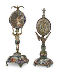 AN AUSTRIAN SILVER-GILT, ENAMEL AND ROCK CRYSTAL FIGURAL STANDING CLOCK AND SIMILAR TABLE ORNAMENT