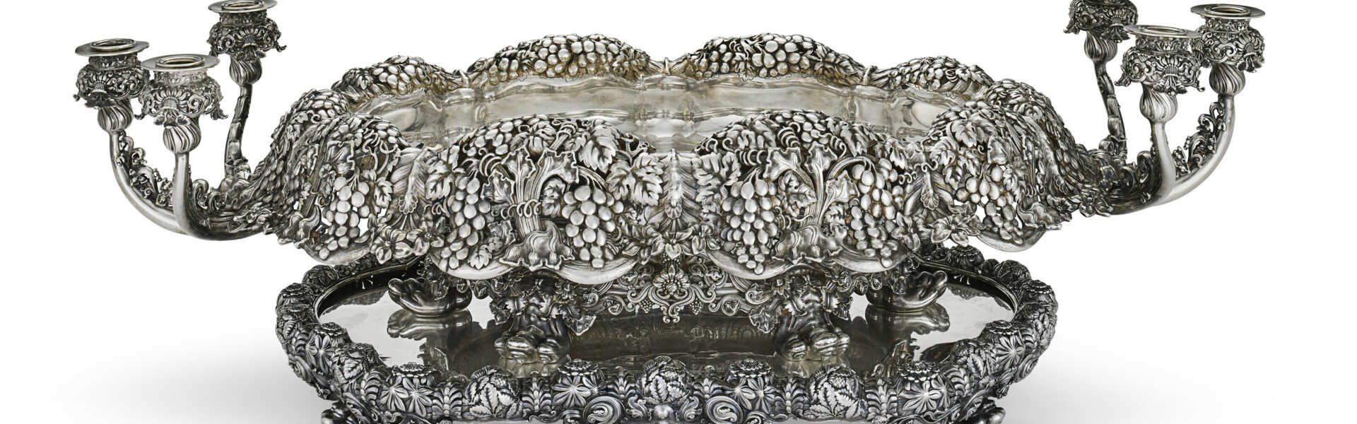 THE HOPKINS-SEARLES CENTERPIECE: AN IMPORTANT AMERICAN SILVER SIX-LIGHT CANDELABRA CENTERPIECE BOWL AND MIRROR PLATEAU
