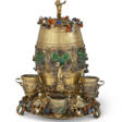 AN AUSTRIAN SILVER-GILT, ENAMEL, HARDSTONE AND PEARL SPIRIT BARREL AND SIX MATCHING CUPS - Archives des enchères