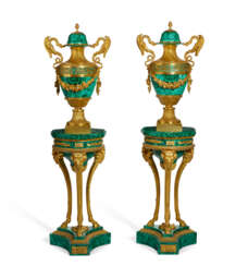 A PAIR OF FRENCH ORMOLU AND MALACHITE VASES ON ASSOCIATED STANDS