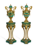 Raingo brothers. A PAIR OF FRENCH ORMOLU AND MALACHITE VASES ON ASSOCIATED STANDS