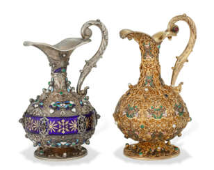 TWO SIMILAR CONTINENTAL SILVER AND SILVER GILT ENAMEL, PEARL, AND GEM-MOUNTED EWERS
