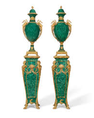 A LARGE PAIR OF ORMOLU AND MALACHITE-VENEERED VASES, ON LOUIS XV STYLE PEDESTALS