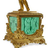 A FRENCH ORMOLU AND MALACHITE VENEERED FIGURE OF A PUTTO - photo 2