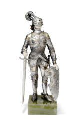 A GERMAN PARCEL-GILT SILVER FIGURE OF A KIGHT