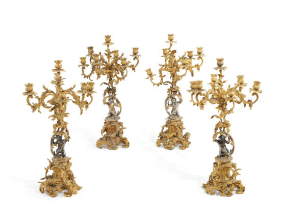 A SET OF FOUR NAPOLEON III GILT AND SILVERED-BRONZE SEVEN-LIGHT CANDELABRA - photo 1