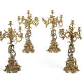 A SET OF FOUR NAPOLEON III GILT AND SILVERED-BRONZE SEVEN-LIGHT CANDELABRA - фото 1