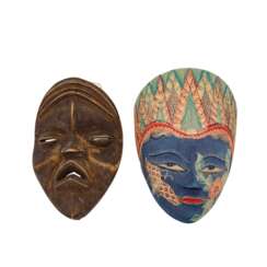 2 face masks made of wood. AFRICA AND JAVA/INDONESIA